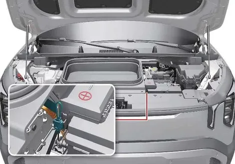 Under-hood layout showing the location of the high-voltage service interlock connector in the Kia EV2
