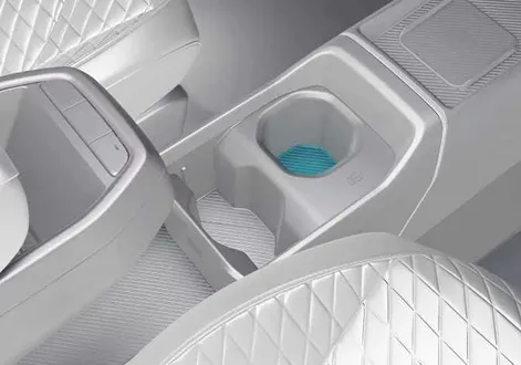 Front center console cup holder layout and design inside the cabin of the Kia EV2