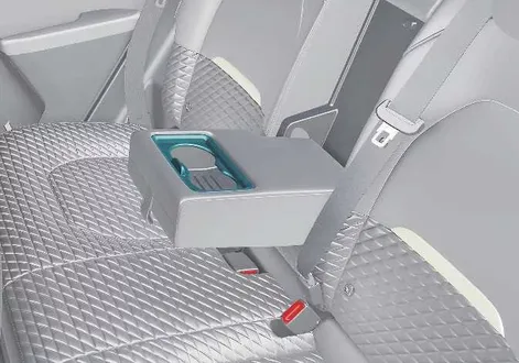 Rear passenger cabin cup holder configuration and integrated trim features in the Kia EV2