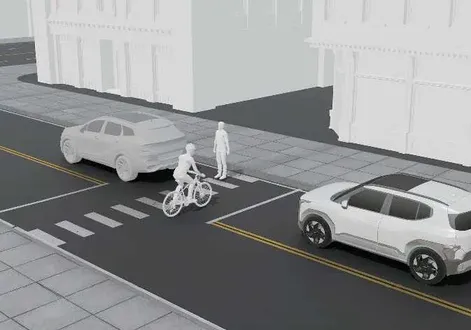 Kia EV2 driver assistance screen showing a vulnerable road user between vehicles