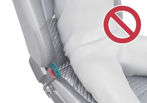 Kia EV2 front seat belt buckle misuse demonstration showing an inserted fake clip without proper harness usage