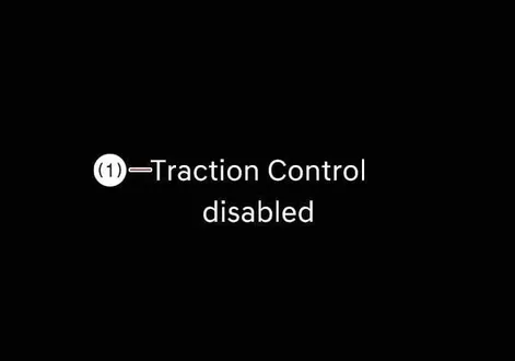 Instrument cluster message indicating Traction Control disabled in the Kia EV2