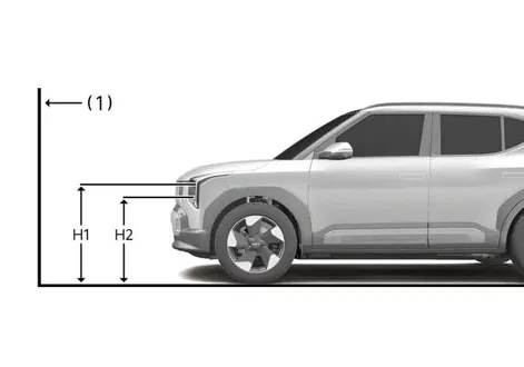 Technical dimensional layout for the left-hand drive Kia EV2 low beam headlamp aiming pattern