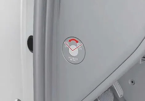 Close-up view of the mechanical key switch mechanism for controlling the Kia EV2 front passenger airbag