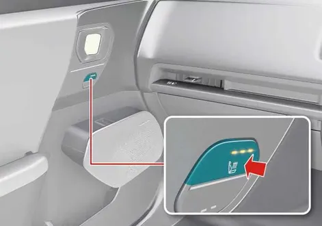 Front passenger seat warmer switch panel and cushion layout in the Kia EV2 interior