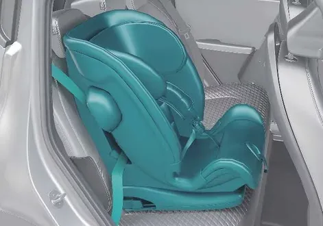 Kia EV2 rear passenger seat showing the correct routing of a lap and shoulder belt through a child safety restraint