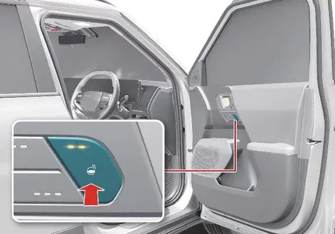 Kia EV2 center console layout showing the dedicated steering wheel heater control button