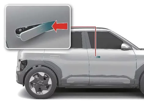 Kia EV2 emergency mechanical key blade insertion point on the driver door handle